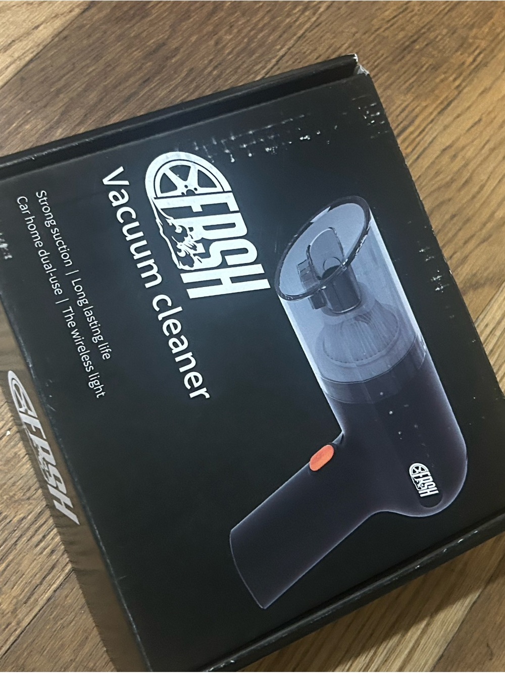fresh Black Handheld Vacuum Cleaner with Orange Accent